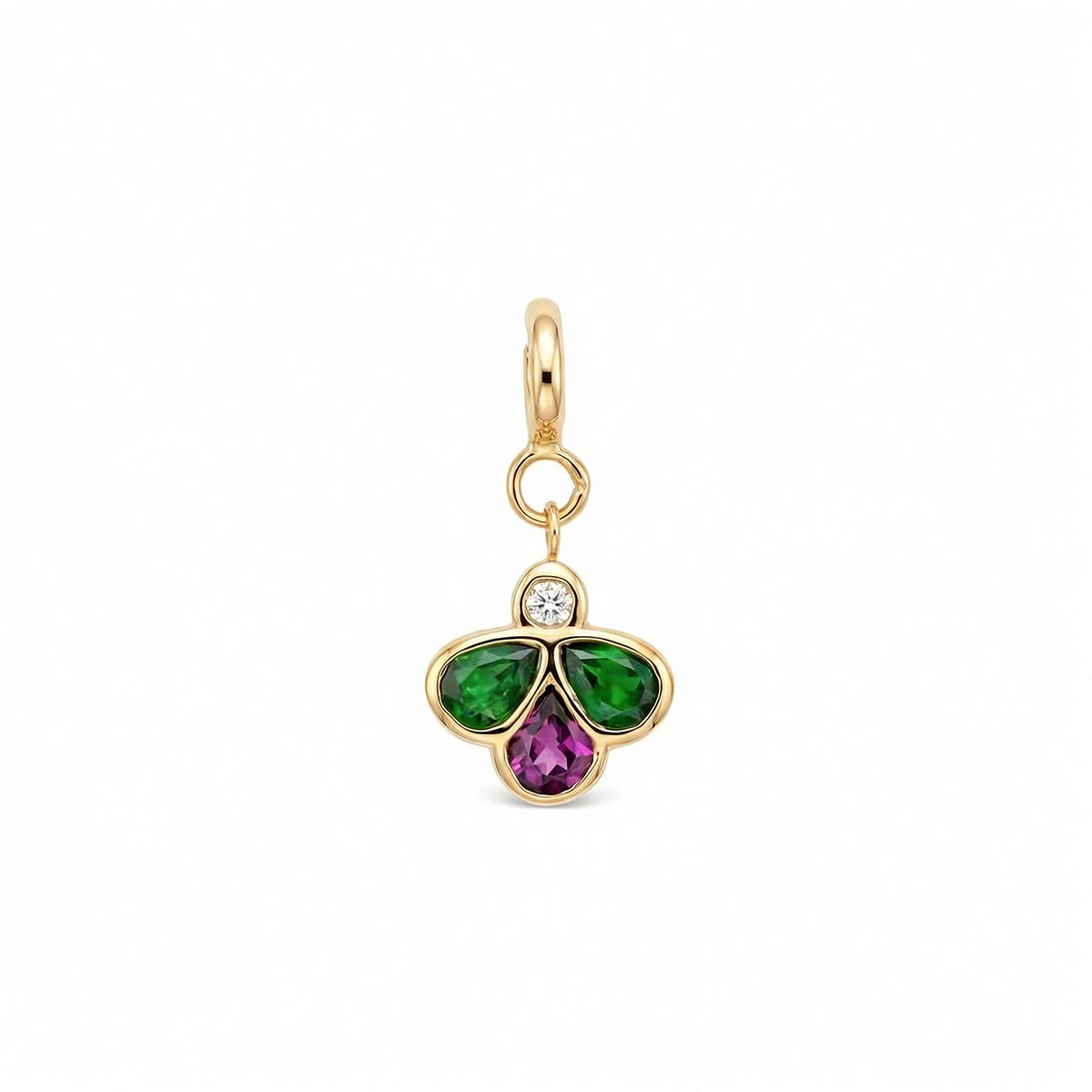 A yellow gold charm pendant featuring a three-petal bee design with a green gemstones on the left and right, a purple pear-cut stone in the center, and a small clear round-cut diamond at the top, set in a polished gold bezel with a hanging loop.