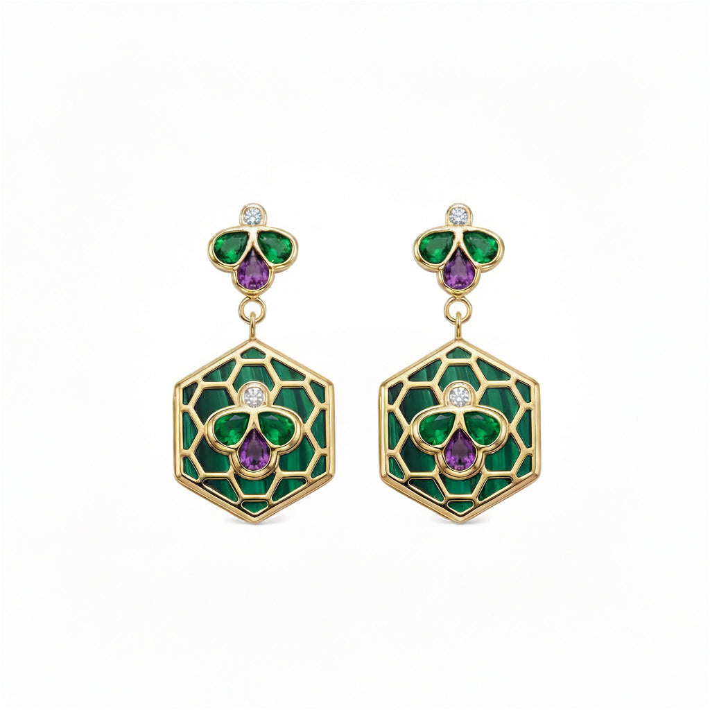 A pair of gold drop earrings featuring Bee Icon 18k yellow gold earrings with tsavorite, rhodolite garnet, malachite, and diamonds shown on a white lain backround.