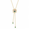 A yellow gold chain necklace with a hexagonal pendant featuring a Bee Icon 18k yellow gold charm with iolite, tsavorite, mother of pearl, and diamond shown on a plain white background.