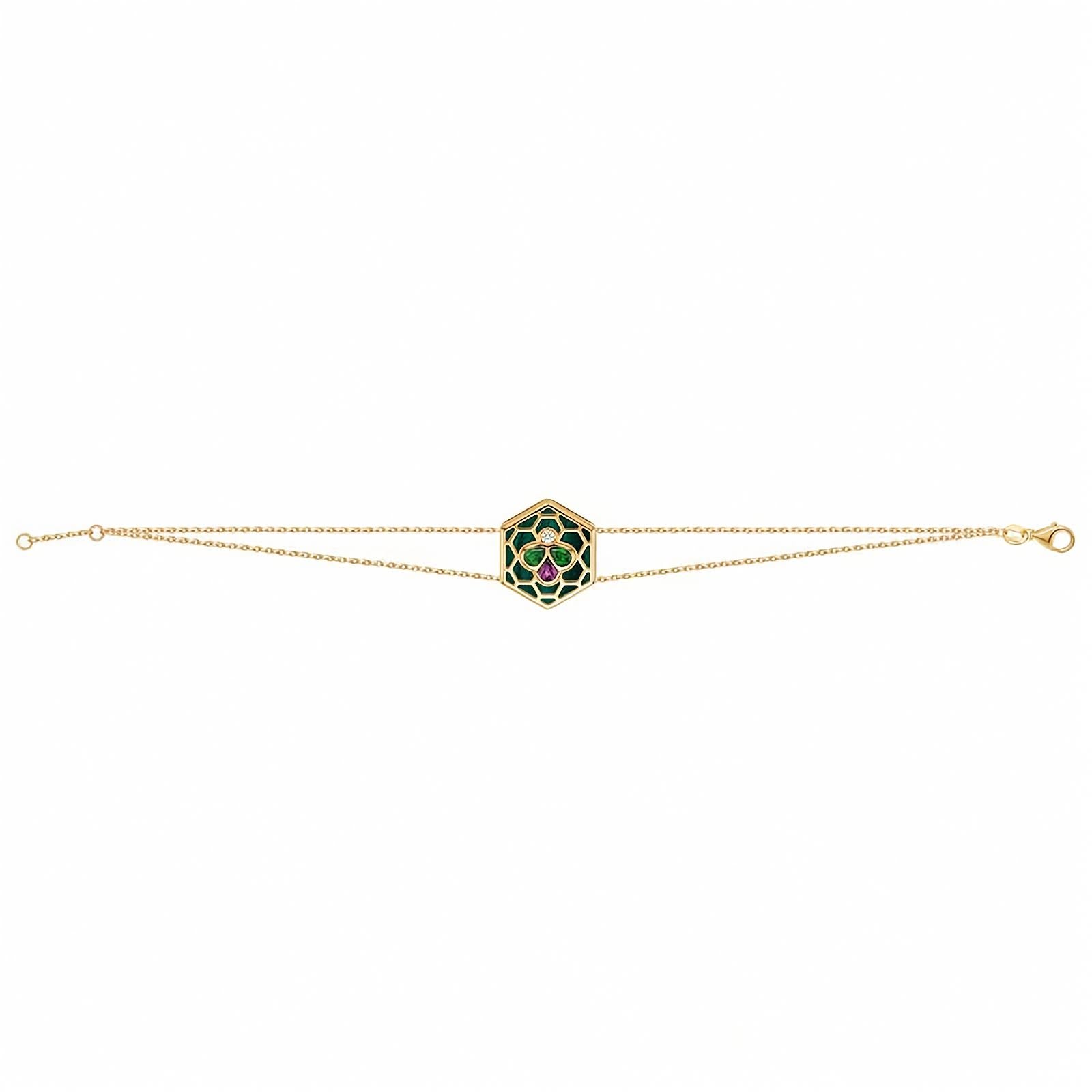Bee Icon 18k yellow gold station bracelet with tsavorite, rhodolite garnet, and malachite shown on a white background.