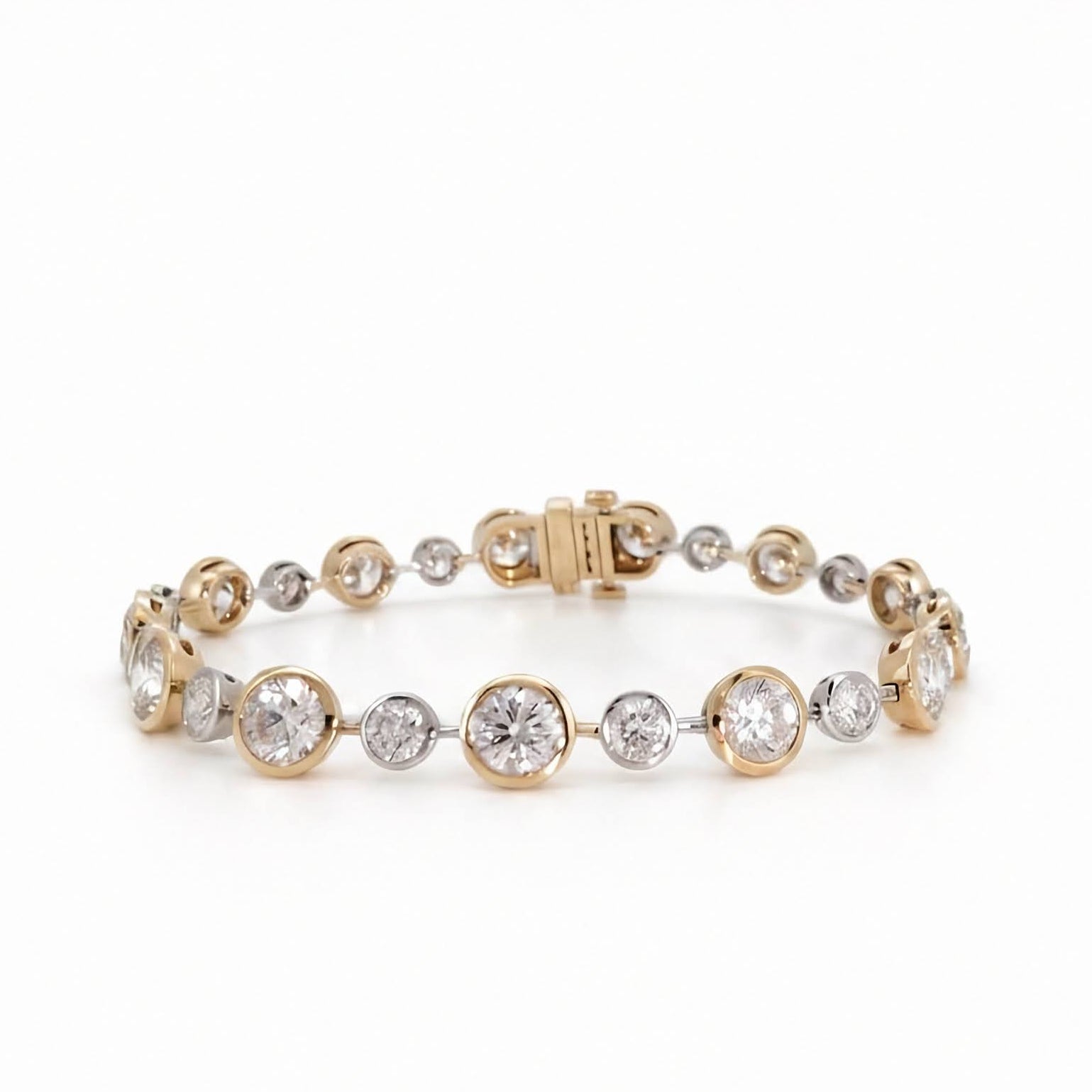 A yellow  and white gold bezel set round diamond bracelet  on a seamless white background.