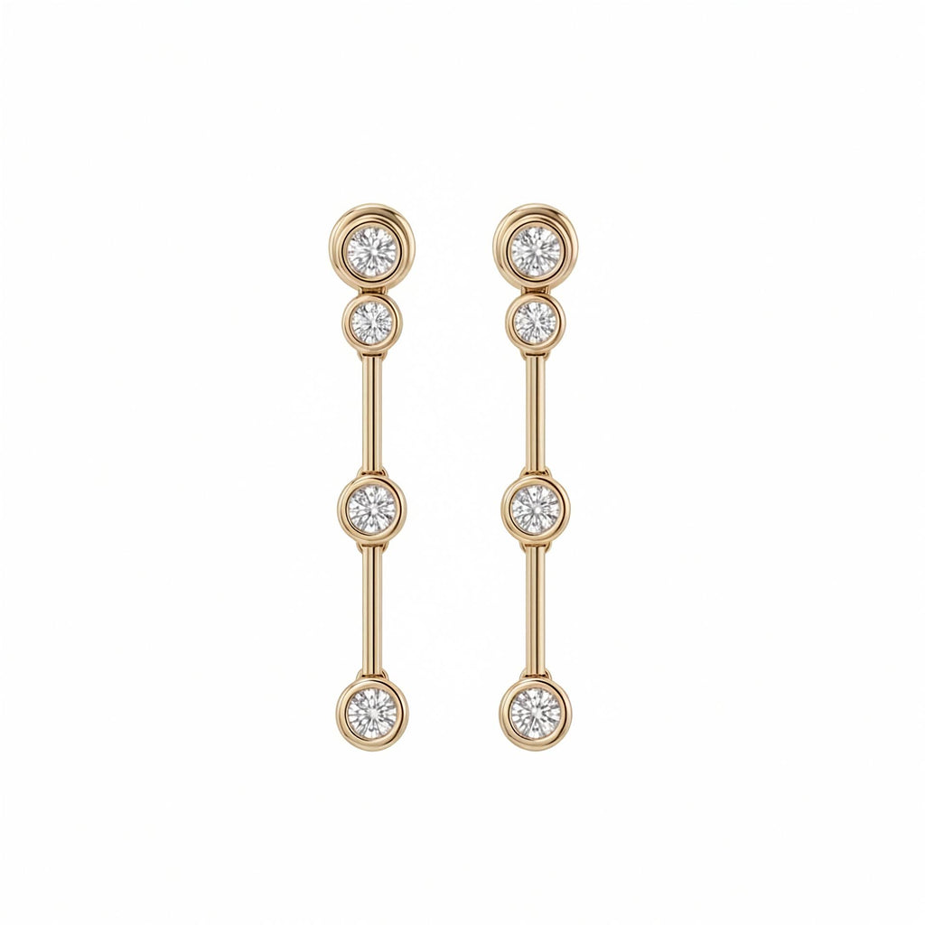 A pair of gold bezel set drop earrings with four round-cut lab grown diamonds on each earring, displayed against a solid white background.