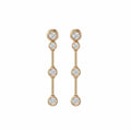 A pair of gold bezel set drop earrings with four round-cut lab grown diamonds on each earring, displayed against a solid white background.