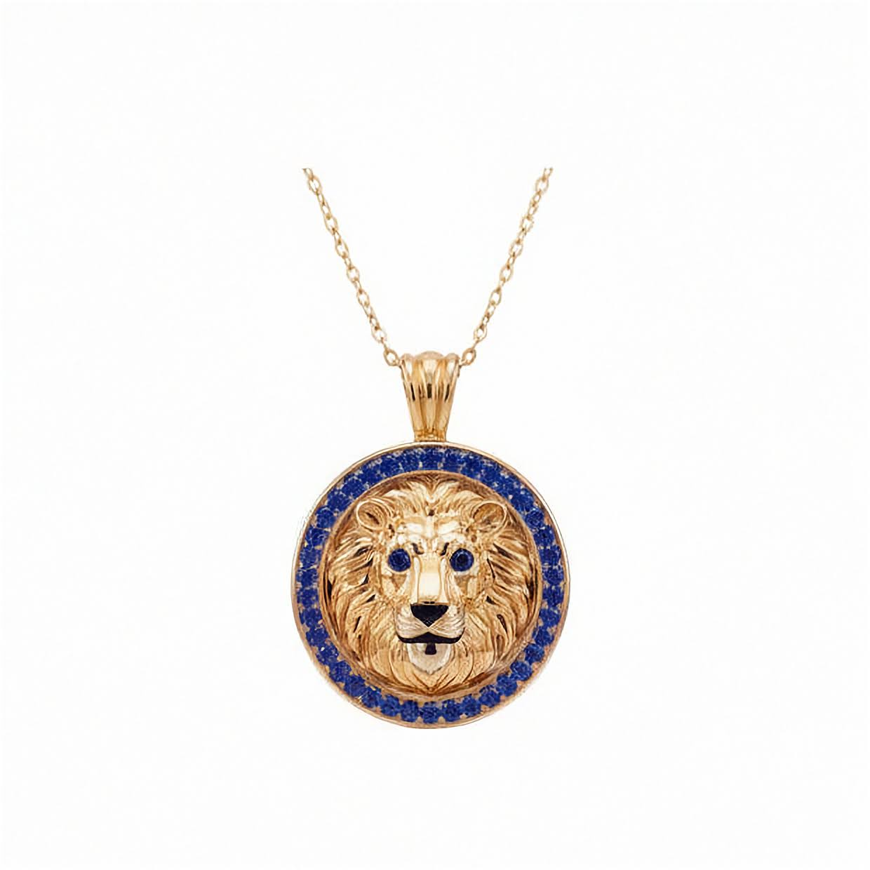 Inga Fine Jewelry Signature Gold Lion Pendant with Lab Grown Blue Sapphires. A gold lion pendant necklace featuring a detailed lion head in the center, surrounded by a halo of small blue sapphire stones, suspended from a delicate gold chain against a plain white background.