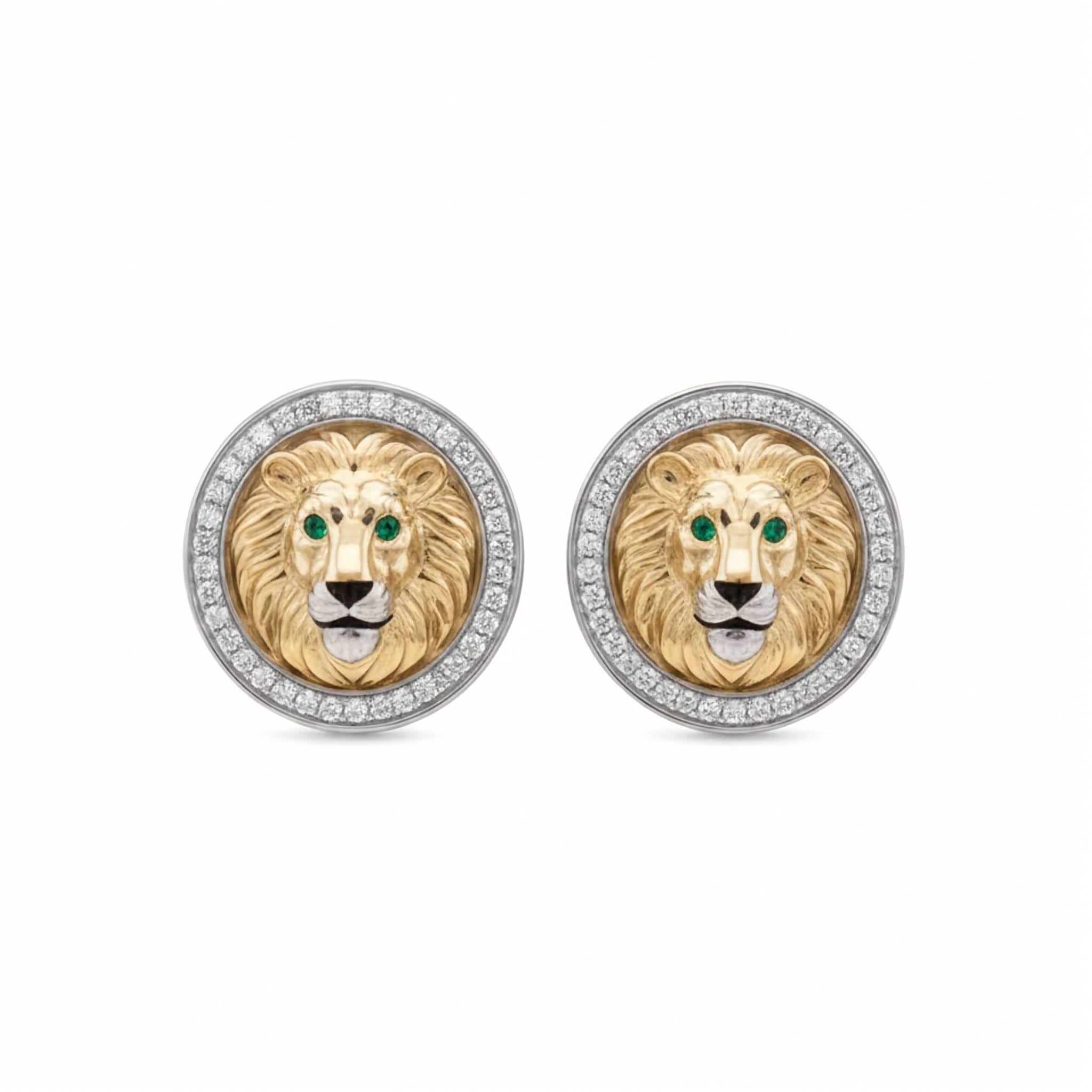 Handcrafted two-tone gold lion head cufflinks with emerald eyes and lab diamond halo border. A pair of Lion cufflinks featuring a detailed lion head in gold and silver, with green eyes and a halo of small white diamonds.