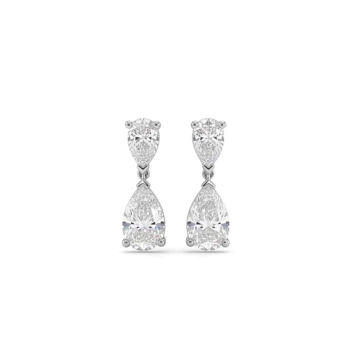 18k white gold 2.00 ctw two-stone lab diamond duo drop earrings. A pair of white gold drop earrings featuring two pear-cut diamonds, set against a plain white background.