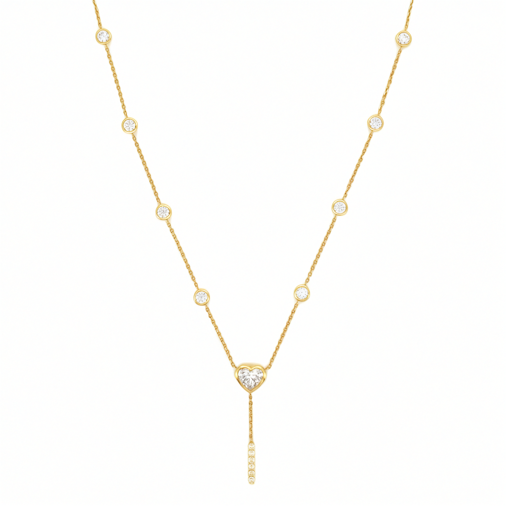 14K yellow gold heart diamond lariat necklace with bezel set station diamonds and pave drop bar on white background.
