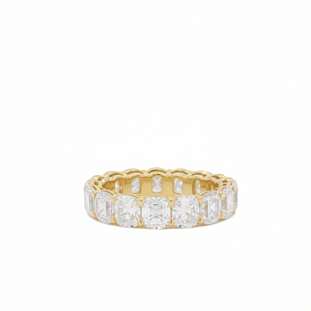 14K yellow gold antique cushion cut diamond eternity band ring 6.30 ctw Inga Fine Jewelry on white background.