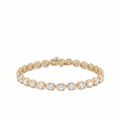 14K yellow gold bezel set oval lab grown diamond tennis bracelet 10.70 ctw Inga Fine Jewelry on white background.