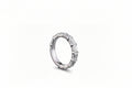 A white gold band ring featuring a row of lab grown emerald-cut diamonds, shown from a side profile on a clean white background. 3/4 all way around the band.