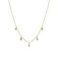 Yellow Gold necklace with small drop bezel set diamonds on a white background.

