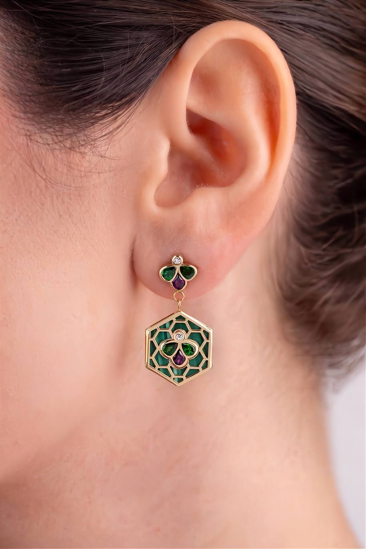 18k gold Bee Icon malachite and gemstone statement dangle earrings worn on model.