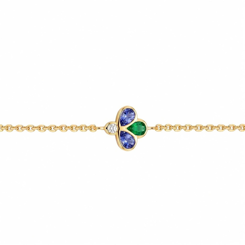 Bee The One 18k yellow gold station bracelet with iolite, tsavorite, and diamond shown on a white background.