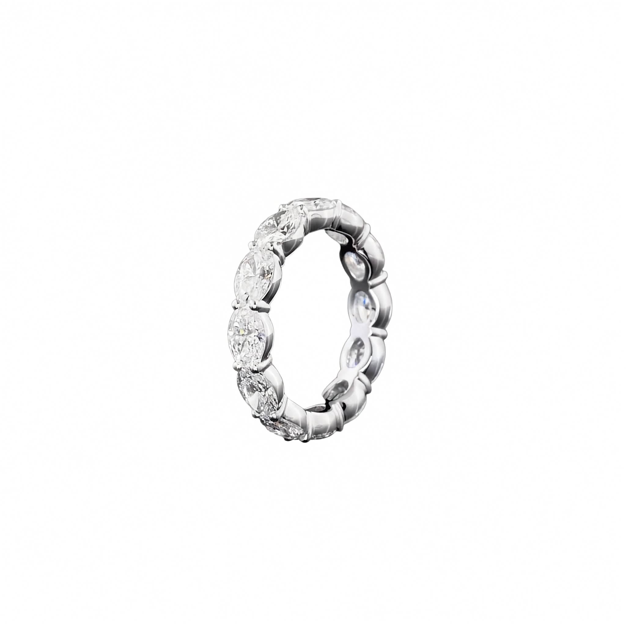 A white gold eternity ring featuring a continuous row of oval-cut lab grown diamonds, photographed on a seamless on a white background.