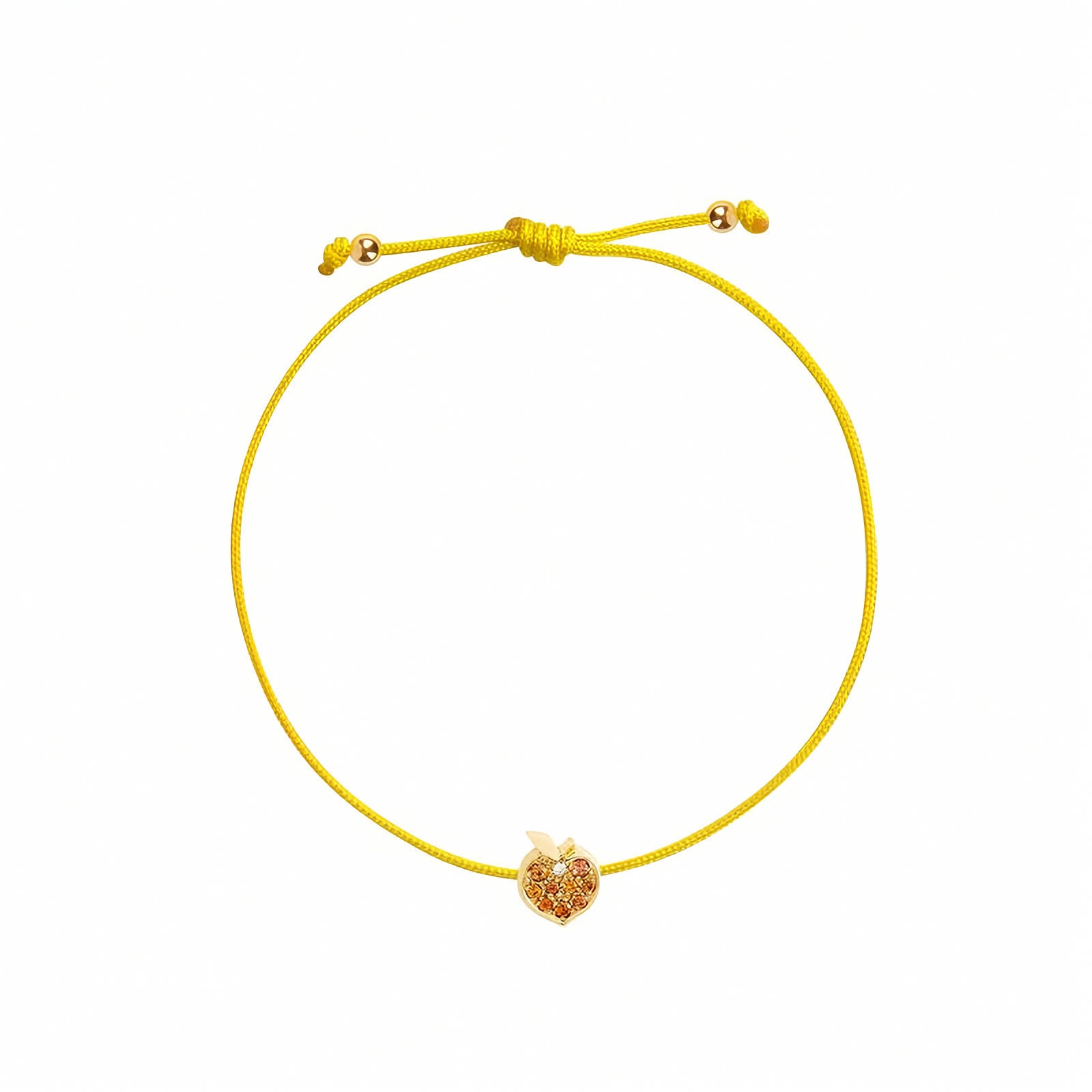 Rosmundo collaboration 18k yellow gold peach string bracelet with natural orange sapphires and diamond on adjustable colorful macrame cord. A yellow cord bracelet featuring a small gold peach-shaped charm adorned with tiny orange stones, presented on a solid white background.