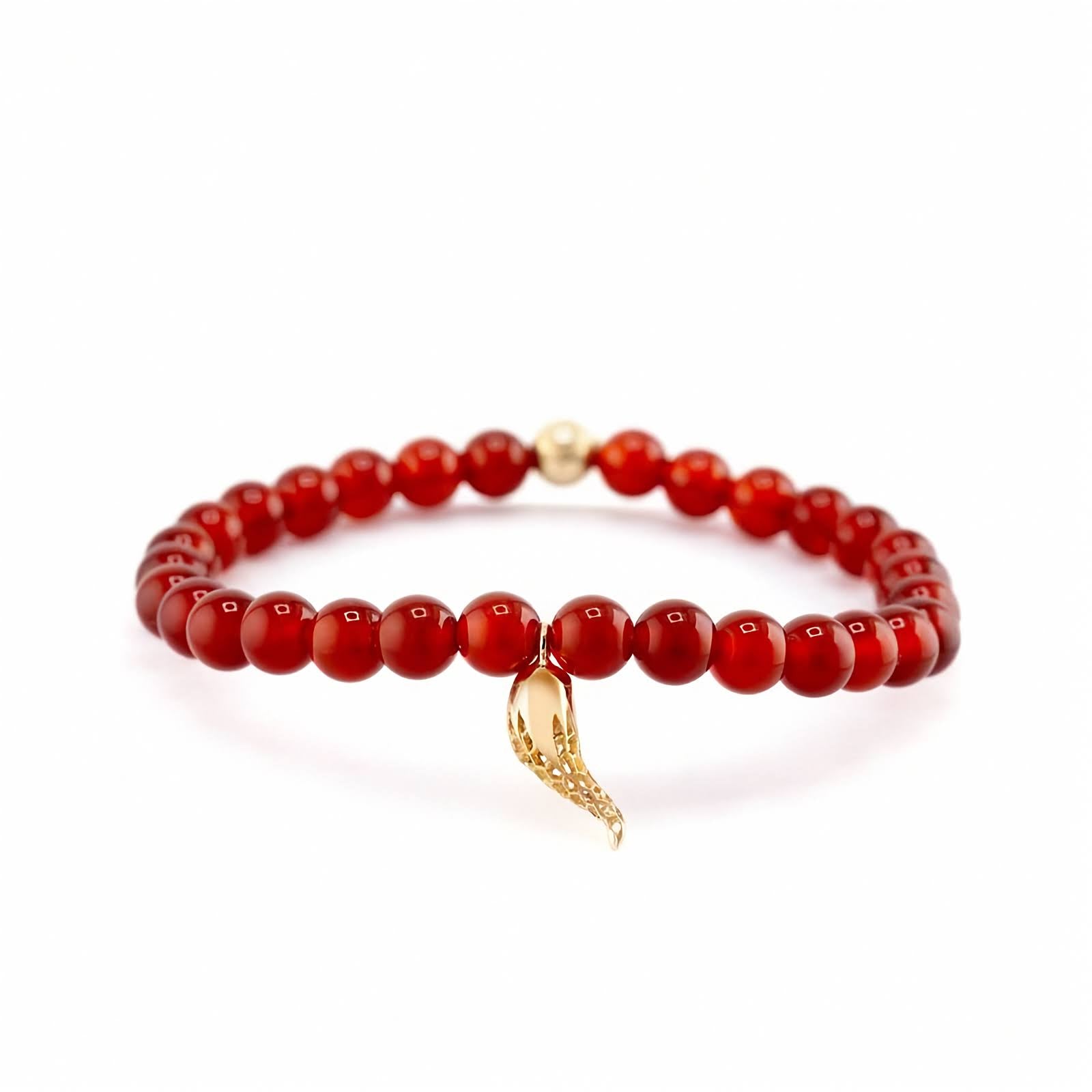 18k Yellow Gold Rosmundo Italian Corno Charm Bracelet with Carnelian Beads. A red beaded bracelet with a small gold horn charm, displayed on a clean white background.