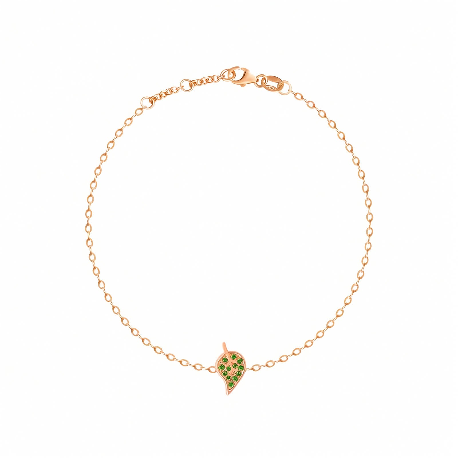 18k Yellow Gold Leaf Chain Bracelet with Natural Tsavorites. A delicate rose gold chain bracelet with a small leaf-shaped charm paved with green stones, displayed on a clean white background.