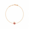 Rosmundo collaboration 18k rose gold apple chain bracelet with natural rubies and diamond. A delicate rose gold chain bracelet with a small apple charm featuring pink gemstone accents, displayed on a clean white background.