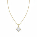 A yellow gold necklace with a single solitaire round diamond pendant, displayed against a solid white background.