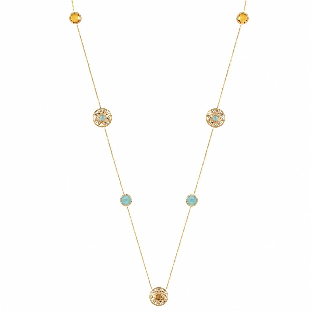 A delicate gold necklace featuring multiple small circular gold ornaments, some with tiny light blue stones and others with textured yellow center stones, displayed on a clean white background.
