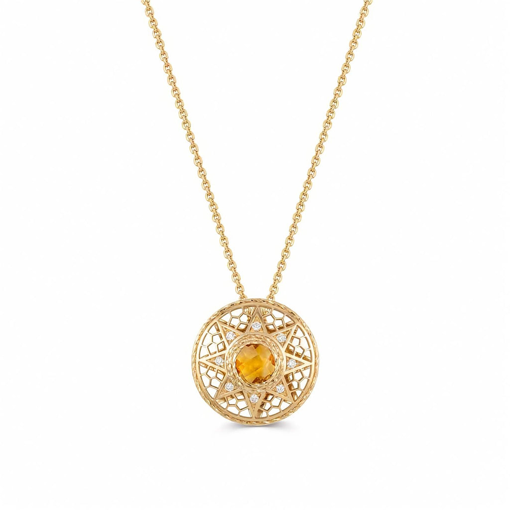 A gold chain necklace with circular pendant  and yellow gemstone accent, shown on a white background.