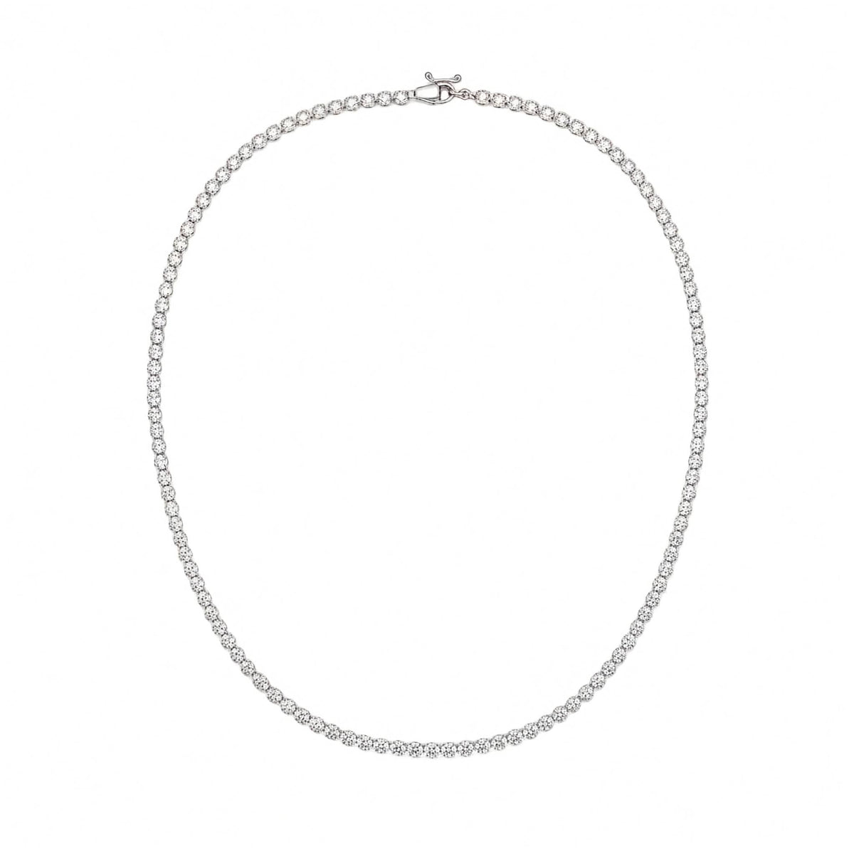 14k white gold four-prong round lab diamond tennis necklace in 5ct total weight agains the plain white background.
