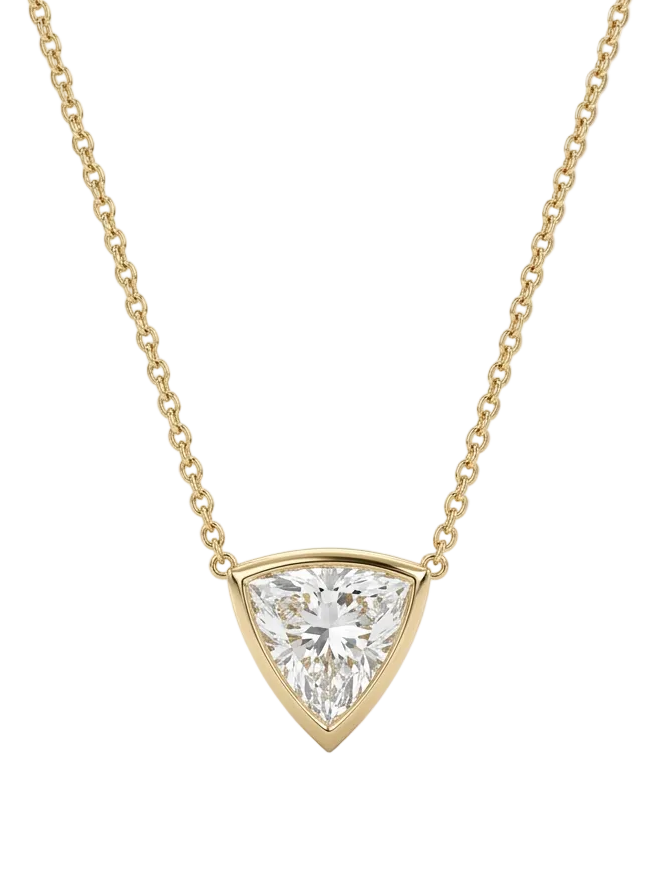 A yellow gold necklace with a delicate chain and a triangular pendant featuring a clear trilliant - cut diamond, shown against a plain white background.