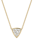 A yellow gold necklace with a delicate chain and a triangular pendant featuring a clear trilliant - cut diamond, shown against a plain white background.
