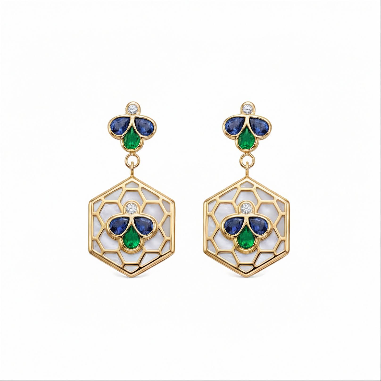 A pair of gold drop earrings featuring a hexagonal openwork design with white inlay, accented by blue and green enamel-like sections and a small round diamond at the top.