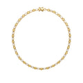 A yellow gold tennis necklace featuring baguette-cut white diamonds and round bezel-set yellow diamonds, arranged in a circular shape on a plain white background.
