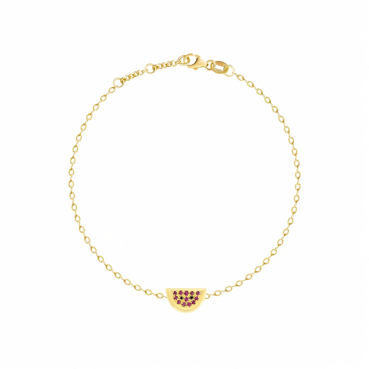 Rosmundo collaboration 18k yellow gold watermelon chain bracelet set with natural rubies and black diamonds. A delicate yellow gold chain bracelet with a small watermelon charm adorned with dark red gemstones, displayed on a clean white background.